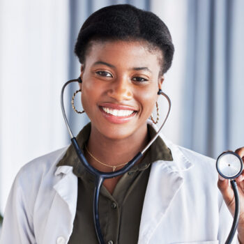 Doctor, portrait and happy woman with stethoscope for heartbeat, healthcare services and cardiology.